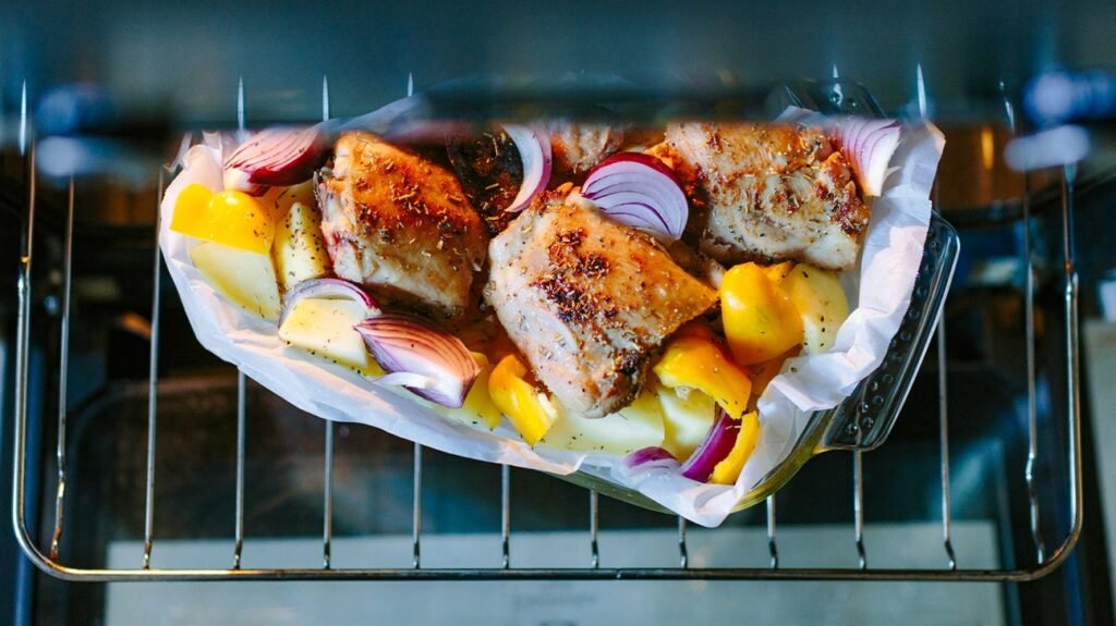 Roasted chicken with potatoes, red onions