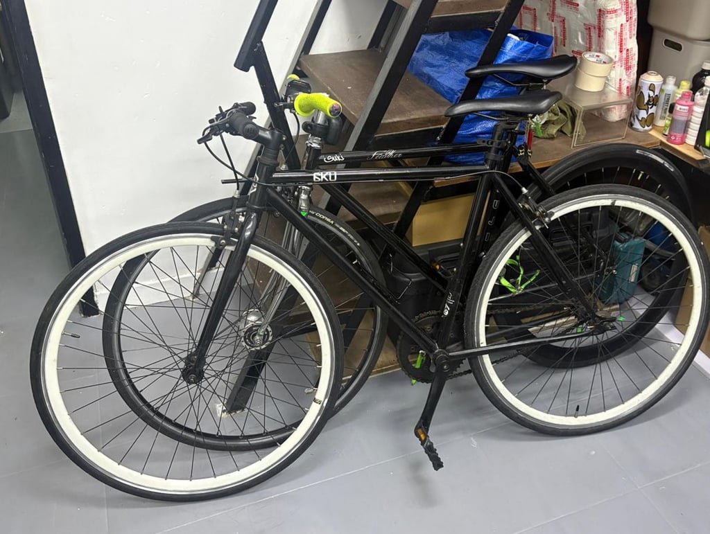 Officers searched an industrial unit in Kwun Tong and seized three bicycles and spray paint. Photo: Handout