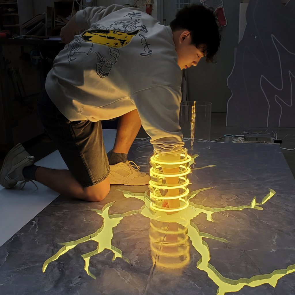 Artist Jerry Loo with the Superhero Landing sculpture featuring at the PMQ exhibition in Hong Kong’s Central district. Photo: Neon Heroes