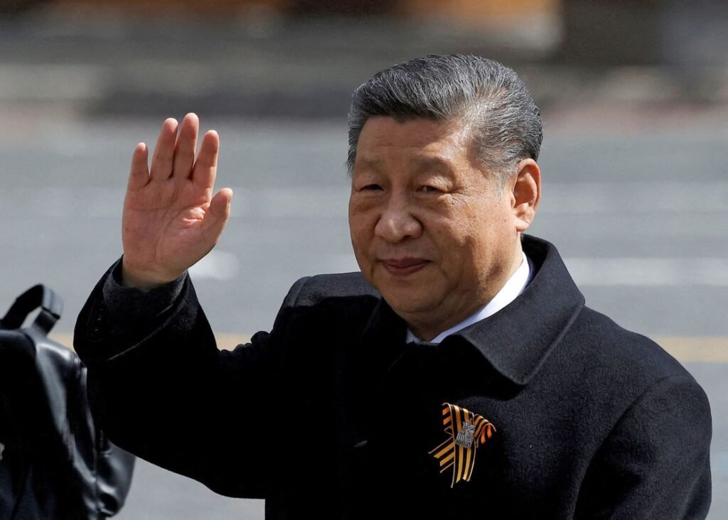 Chinese President Xi Jinping waves to spectators as he leaves after a military parade on Victory Day, marking the 80th anniversary of World War Two, in Moscow on May 9, 2025.