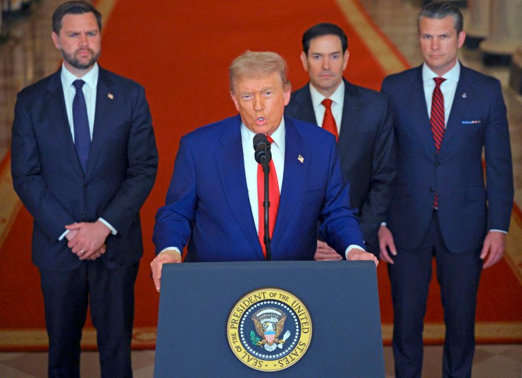 Trump addresses the nation from a lectern at the White House.