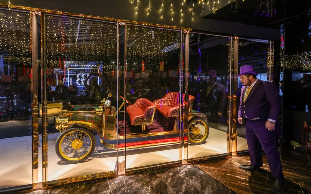 The signature golden Rolls-Royce vintage car of Club Bboss gets the spotlight at the launch of the Big Boss Generation nightspot in Tsim Sha Tsui East. Photo: Nora Tam