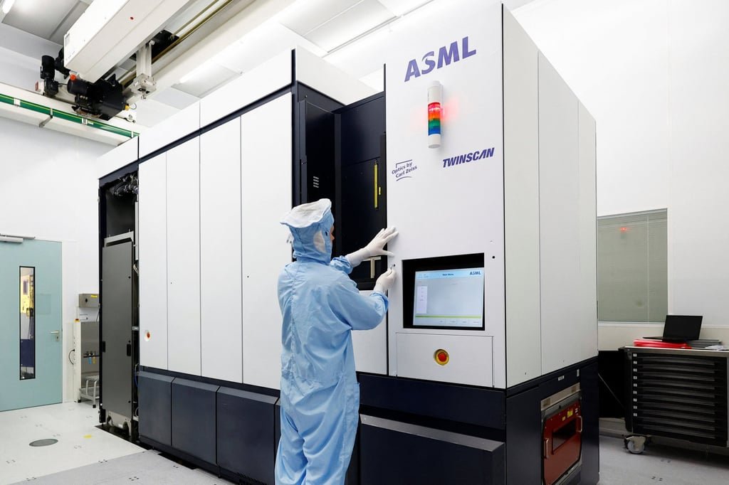 An engineer works on a Twinscan DUV lithography system at ASML in Veldhoven, Netherlands, in June 2023. Photo: Reuters