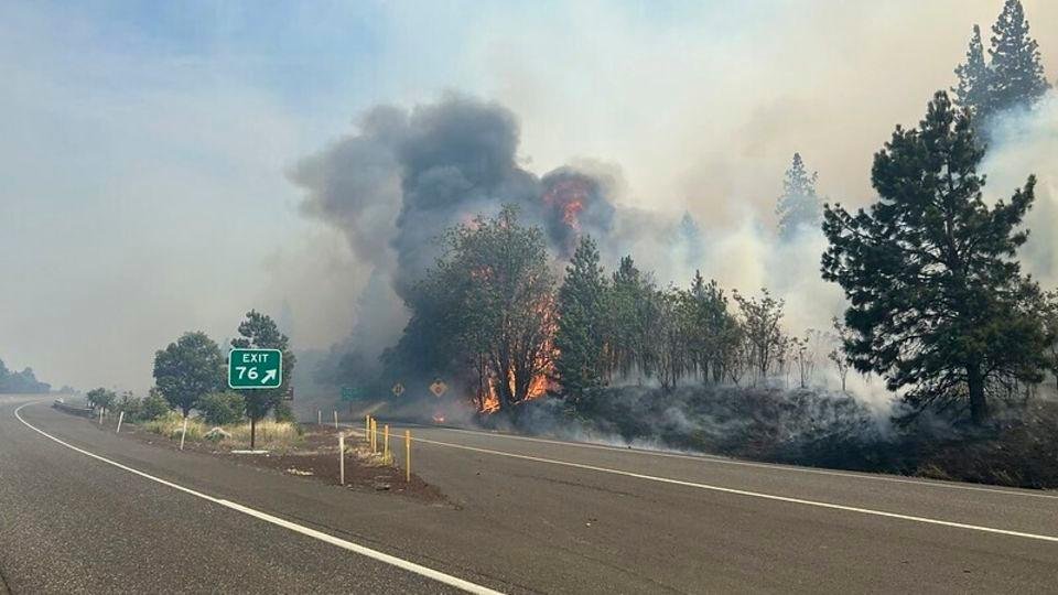 The Rowena Fire burns near Interstate 84 in northern Oregon on Wednesday. - Oregon Department of Transportation via AP