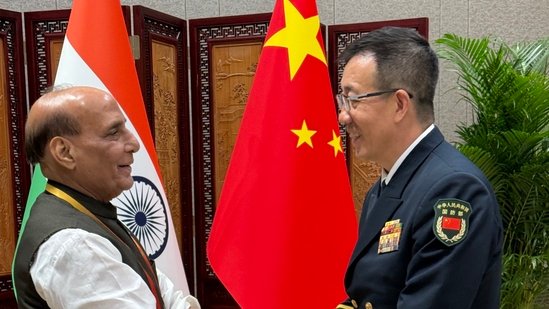 Defence Minister Rajnath Singh with China's Admiral Don Jun. (Source: X/@rajnathsingh)