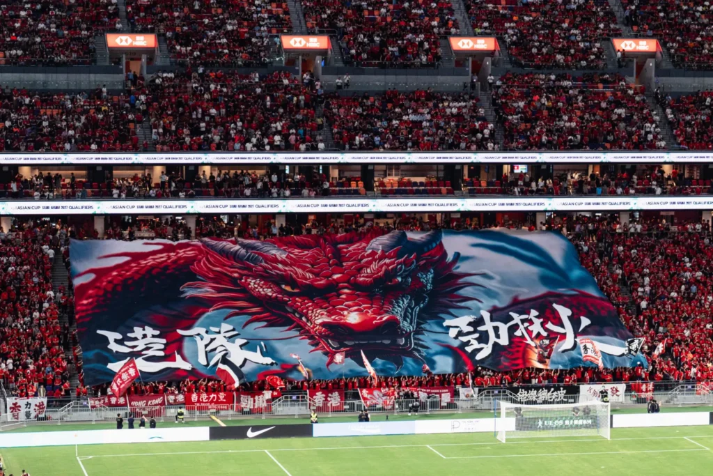 Hong Kong football fans unfurl a large banner at Kai Tak Stadium on June 10, 2025. Photo:  OneTwo.hk.