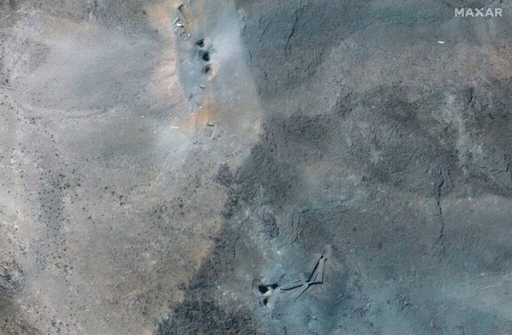 This satellite image provided by Maxar Technologies shows a close-up view of holes and craters on a ridge at the Fordow enrichment facility in Iran after US strikes, Sunday, June 22, 2025.