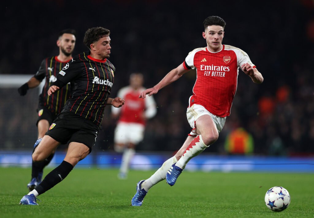 LONDON, ENGLAND - NOVEMBER 29: Declan Rice of Arsenal battles for possession with Neil El Aynaoui of RC Lens during the UEFA Champions League match between Arsenal FC and RC Lens at Emirates Stadium on November 29, 2023 in London, England. (Photo by Richard Heathcote/Getty Images)
