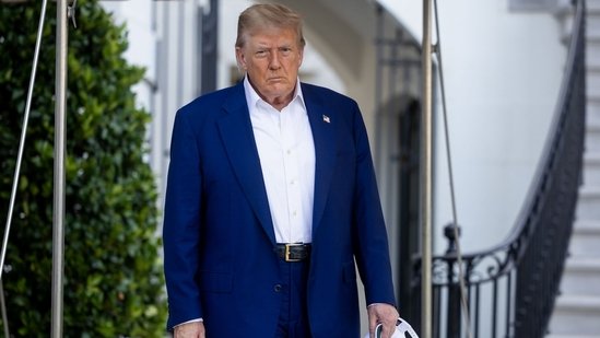 US President Donald Trump walks on the South Lawn of the White House before boarding Marine One in Washington, DC on Tuesday, June 24(Bloomberg)