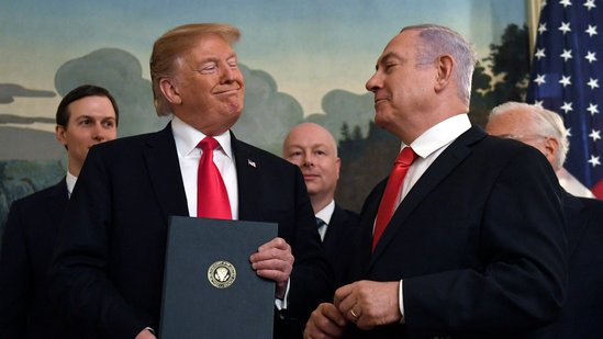 FILE - In this March 25, 2019 file photo, President Donald Trump smiles at Israeli Prime Minister Benjamin Netanyahu, right, after signing a proclamation at the White House in Washington. (AP Photo/Susan Walsh, File)(AP)