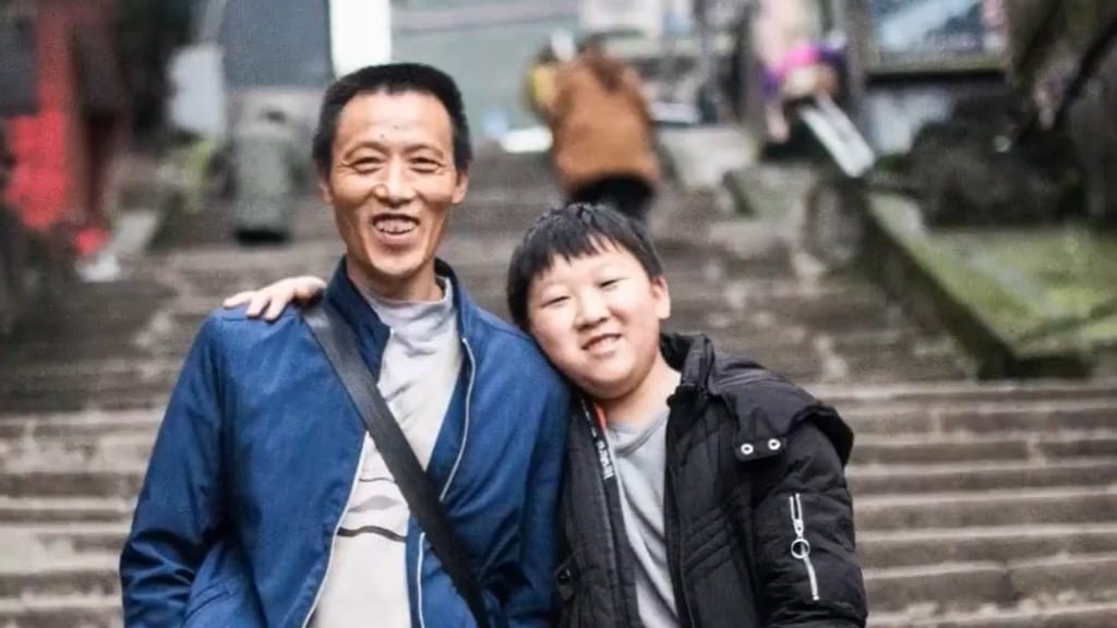 Proud father Ran Guanghui and his now grown-up son, Ran Junchao, are all smiles. Photo: handout