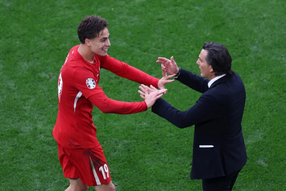 Turkey DORTMUND, GERMANY - JUNE 18: Kenan Yildiz of Turkiye celebrates with Vincenzo Montella, Head Coach of Turkiye, after scoring a goal, which is later disallowed following an offside decision via a VAR Review, during the UEFA EURO 2024 group stage match between Turkiye and Georgia at Football Stadium Dortmund on June 18, 2024 in Dortmund, Germany. (Photo by Kevin C. Cox/Getty Images) Turkey