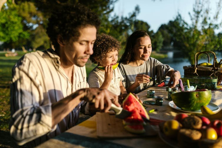 Family eats outdoors