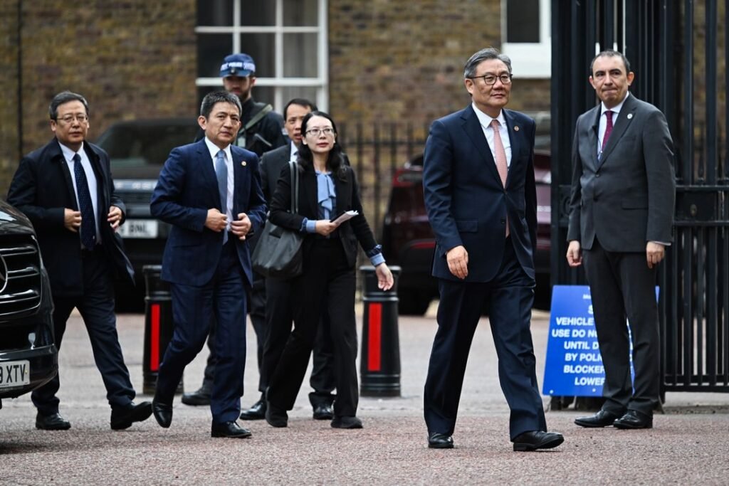 Li Chenggang, China's vice commerce minister, second left, and Wang Wentao, China's commerce minister, second right, arrive for trade talks at Lancaster House in London, UK, on June 10, 2025.