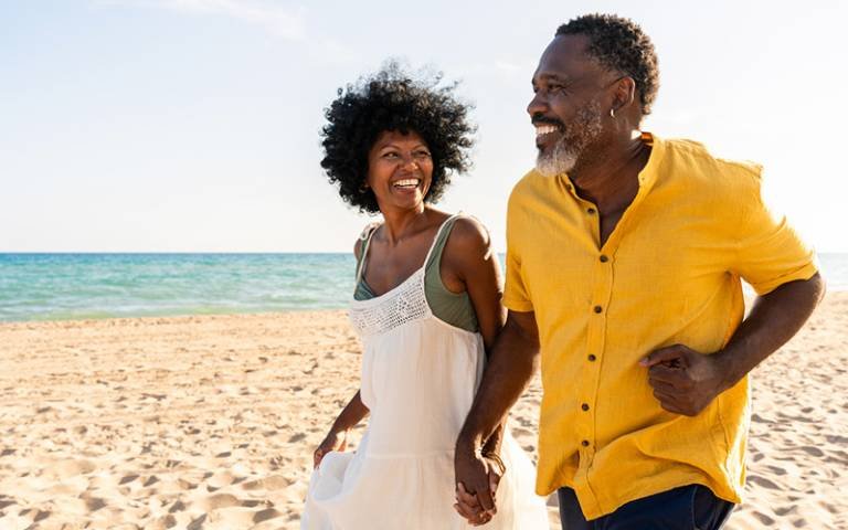 Two happy people on a beach