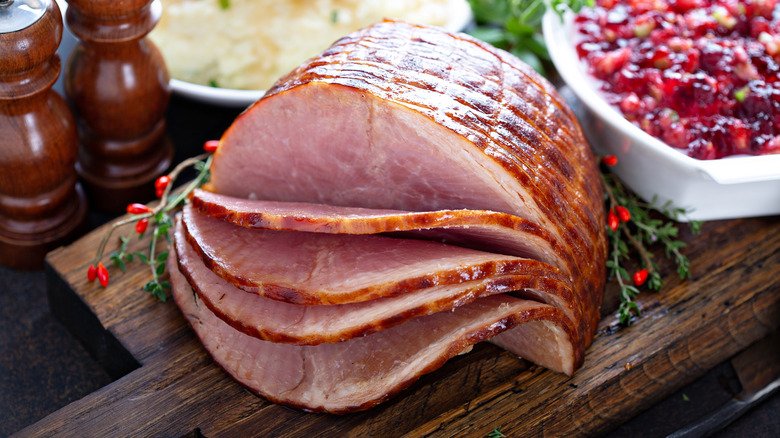 a holiday ham spiral sliced on board