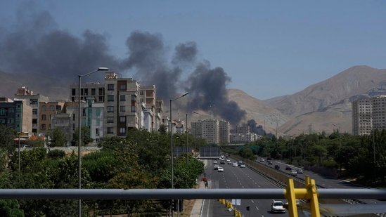 Iran Israel war news live updates: Smoke rises from an oil storage facility after it was struck by an Israeli strike in Tehran