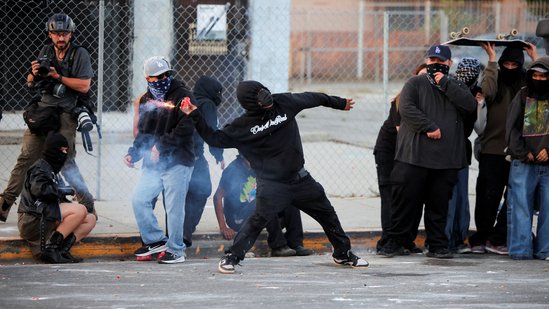 A protester throws a firework during a standoff between police and protesters following multiple detentions by Immigration and Customs Enforcement (ICE), in the Los Angeles County city of Paramount, California, U.S., June 7.(Reuters)