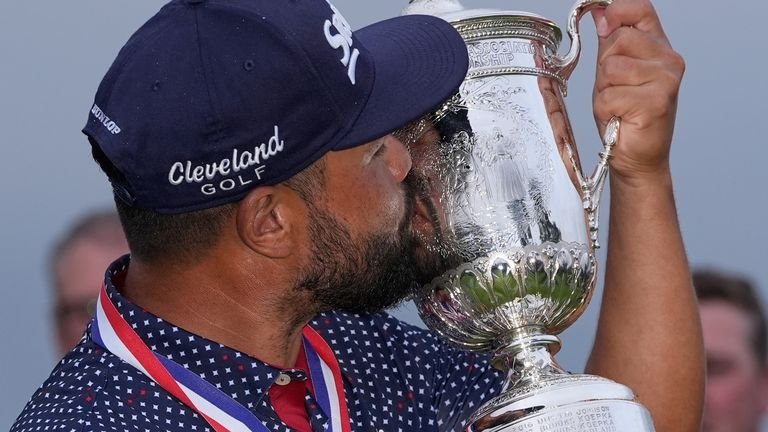 J.J. Spaun celebrates with the trophy after winning the U.S. Open golf tournament at Oakmont Country Club Sunday, June 15, 2025, in Oakmont, Pa. (AP Photo/Carolyn Kaster)