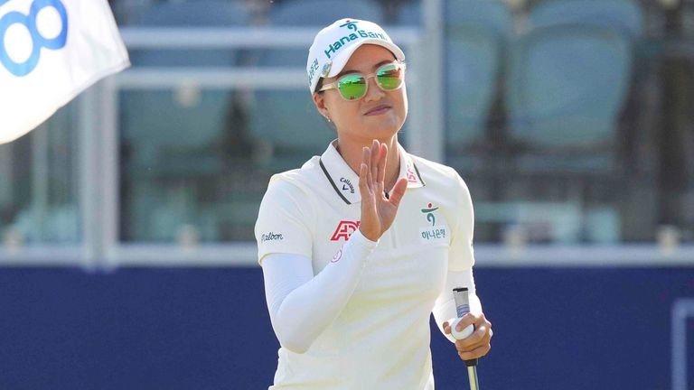 Minjee Lee waves after playing the 18th hole during the third round of the Women's PGA Championship golf tournament Saturday, June 21, 2025, in Frisco, Texas. (AP Photo/LM Otero)