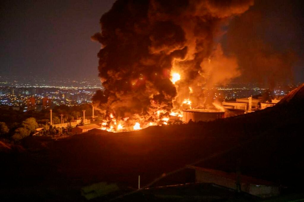 Fire and smoke rise after an Israeli attack on the Shahran oil depot on June 15 in Tehran, Iran.