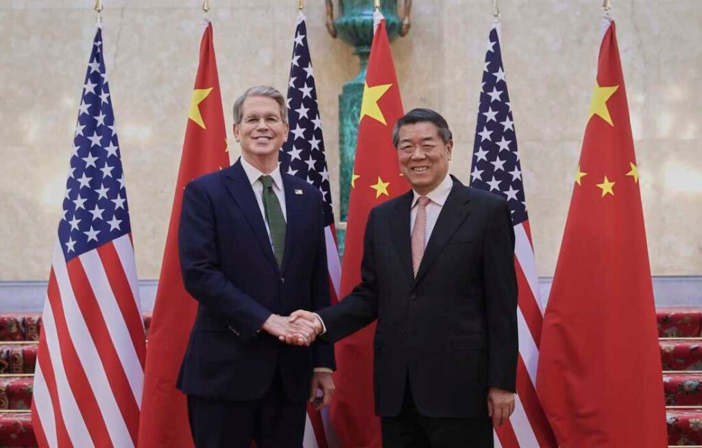 In this photo released by Xinhua News Agency, Chinese Vice Premier He Lifeng (right) shakes hands with U.S. Treasury Secretary Scott Bessent before their meeting to discuss China-U.S. trade, in London on Monday. (Li Ying/Xinhua via AP)