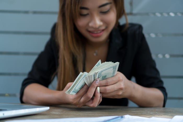 A person counting money.