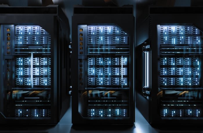 Server racks housing GPU clusters in a data center.