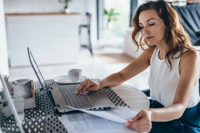 A person looking at a computer.
