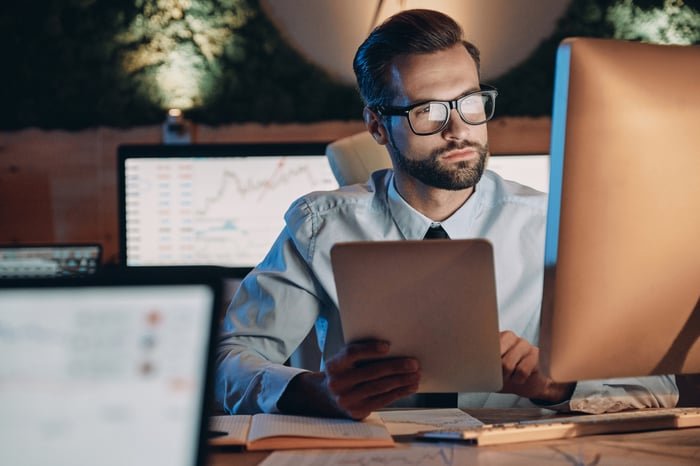 Person sitting at a desk working on a computer.