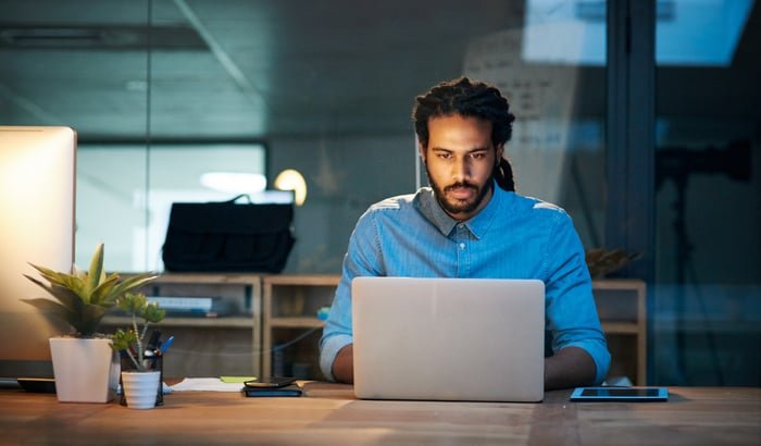 Person looking at a laptop.