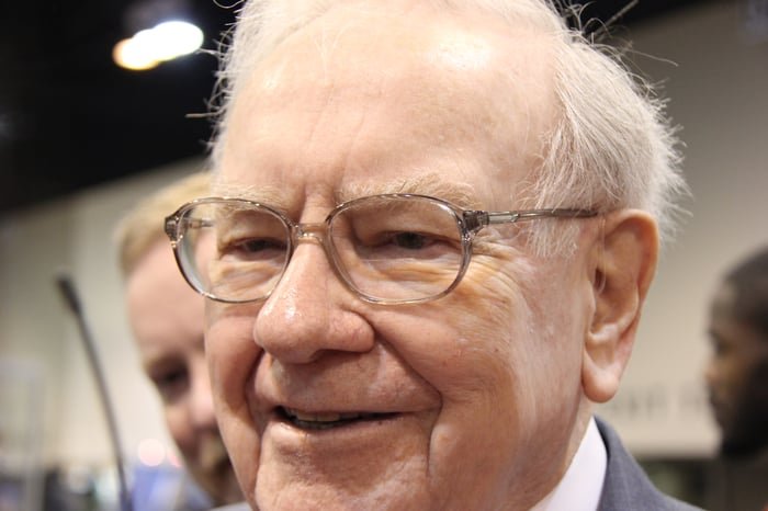 Close-up photo of Warren Buffett at an event.