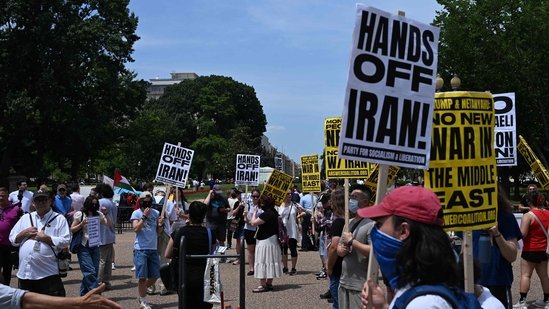 Iran Israel war live updates: People hold signs as they demonstrate in front of the White House in Washington, DC, against US strikes on Iranian nuclear sites.