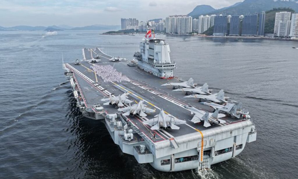 This photo shows the aircraft carrier <em>Shandong</em> sailing in Hong Kong waters, South China, July 3, 2025. A fleet of the Chinese People's Liberation Army Navy led by the aircraft carrier <em>Shandong</em> arrived in the Hong Kong Special Administrative Region on the day. Photo: Xinhua