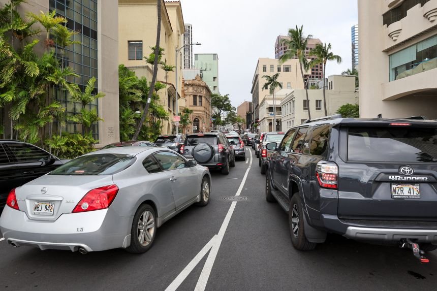 Traffic builds on Bethel Street heading north in downtown Honolulu after authorities warned residents of the possibility of a destructive tsunami.