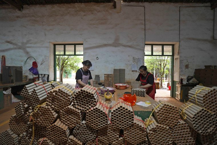 Workers making fireworks at a factory in Liuyang, China.