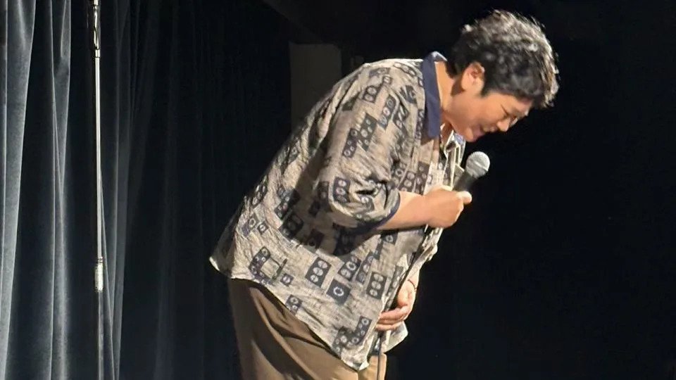 Fan Chunli, the 50-year-old comedian coming from rural China, hits up an open mic night at a comedy club. - Obtained by CNN