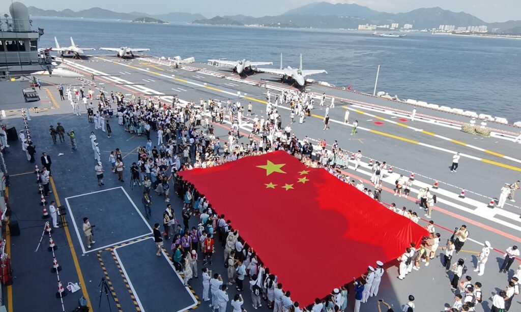 Students and teachers in Hong Kong toured the aircraft carrier Shandong of the Chinese People's Liberation Army, visiting various carrier-based aircraft on the flight deck, tried on deck crew identification vests, and took photos with naval officers during the Shandong's public open-house events on July 4, 2025. Photo: VCG