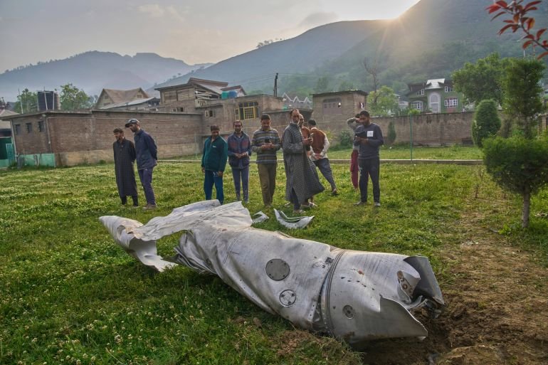 Debris of an aircraft lie in the compound of a mosque at Pampore in Pulwama district of Indian controlled Kashmir