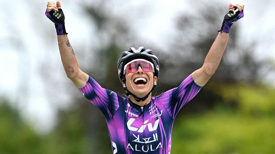 Mavi Garcia holds up her arms and smiles