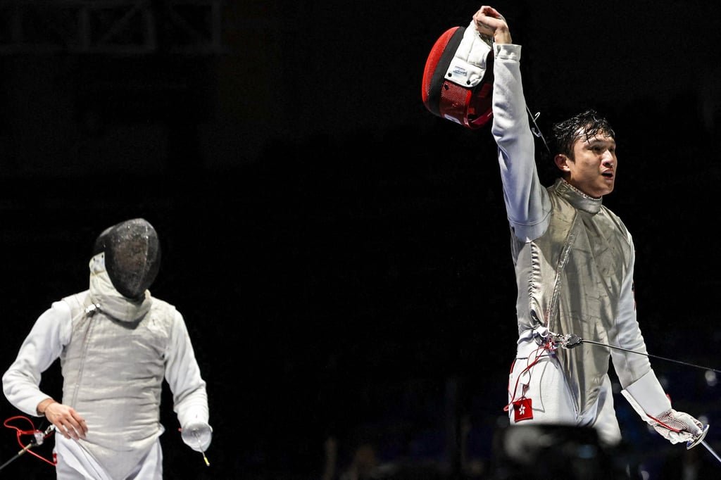 Ryan Choi (right) celebrates his victory over Kirill Borodachev in Tbilisi. Photo: AFP