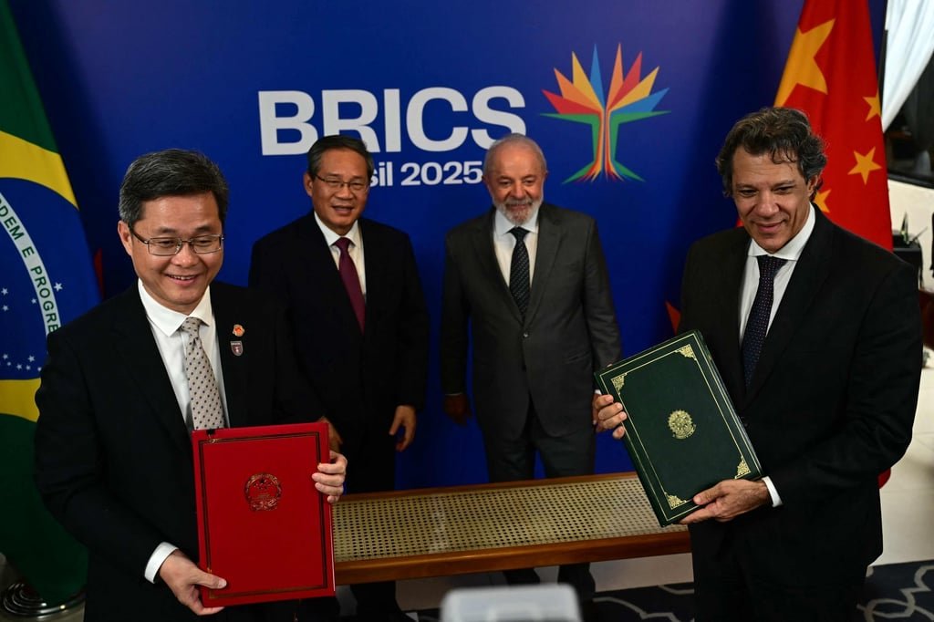 Li Qiang and Luiz Inácio Lula da Silva pose with Chinese Finance Minister Lan Foan (far left) and Brazil’s Economy Minister Fernando Haddad after the signing of a bilateral agreement, in Rio de Janeiro on Friday. Photo: AFP