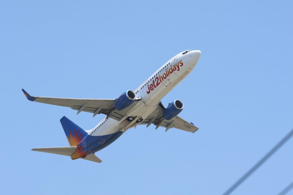 Jet2 Commercial Airplane in Flight Against Blue Sky