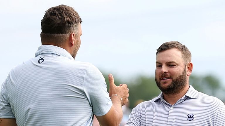 MUNICH, GERMANY - JULY 06: Daniel Brown of England (L) is congratulated by Jordan Smith of England on the 18th green following his victory on day four of the BMW International Open 2025 at Golfclub Munchen Eichenried on July 06, 2025 in Munich, Germany. (Photo by Richard Heathcote/Getty Images)