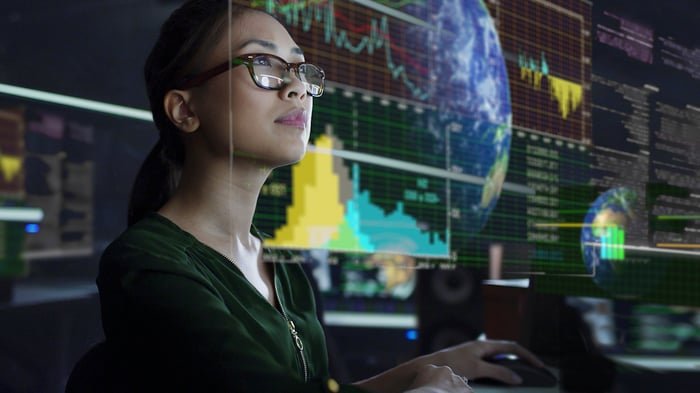Person looking at a chart with data.