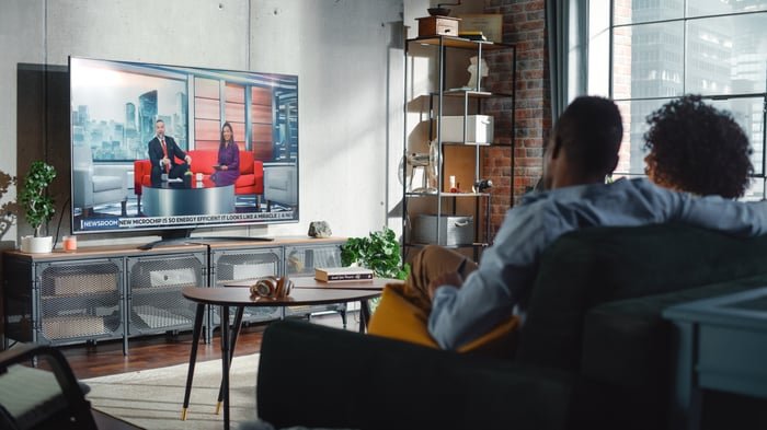 A couple watching TV.