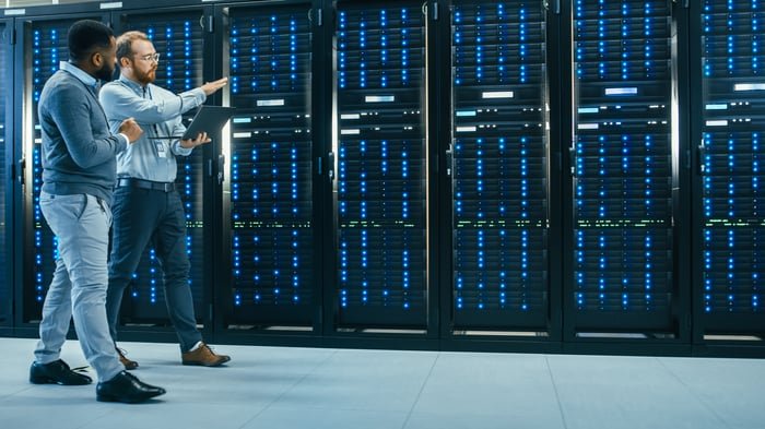 Server racks with  GPU clusters inside of a data center.