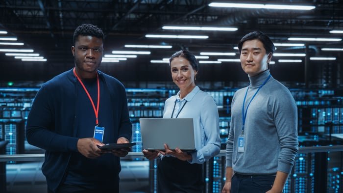 IT workers inside of a data center.