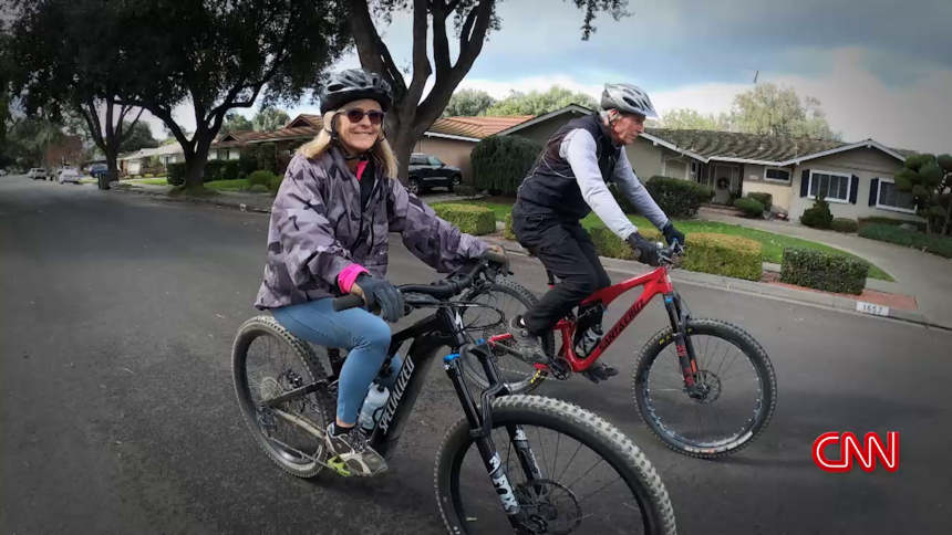 Due to her cognitive improvement, Tammy Maida (left) and her husband Paul enjoy biking together again.
