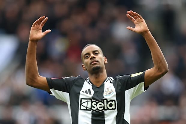 Alexander Isak with his arms raised.